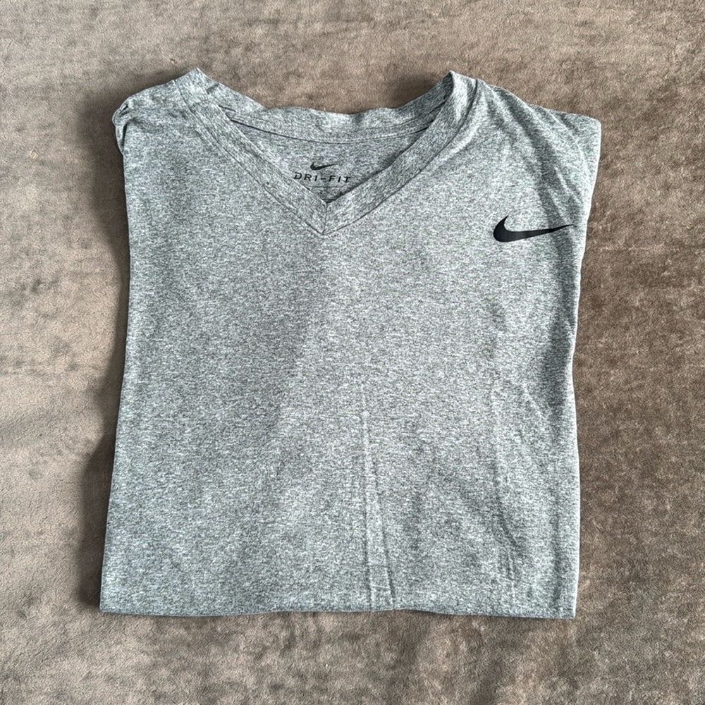 Nike Dri-Fit tee. Vneck. Short sleeve. Logo on front Color- gray. Size- large.